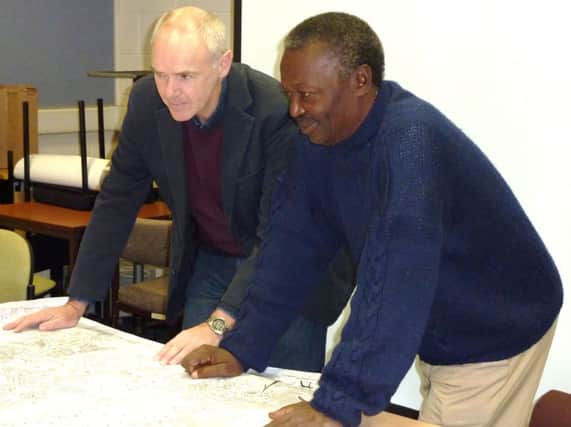 Wusu Sannoh (right) with John Archer, One World Link's chairman for development in Bo.