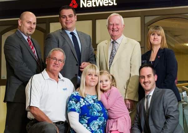 Staff have raised money at Natwest Bank, Royal Priors Shopping Centre, Leamington Spa, have raised money for Matilda Henley, who has a rare eye disease.  Pictured L to R (back): Martin French (Natwest Bank), Matt Marsh (Natwest Bank), Clive Stone (Vice President - Fight for Sight) & Janet Gilbert (Natwest Bank). L to R (Front): Keith Wykes (Fight for Sight), Claire & Matilda Henley & Steve Hutchings (Natwest Bank).