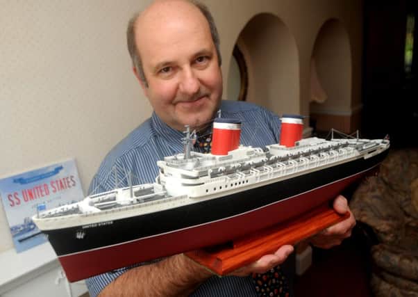 Retired teacher Andrew Britton who is writing a series of books about great ocean liners. He is seen with a model of the S.S. United States. MHLC-12-06-12 violin jun71 ENGNNL00120120613094845