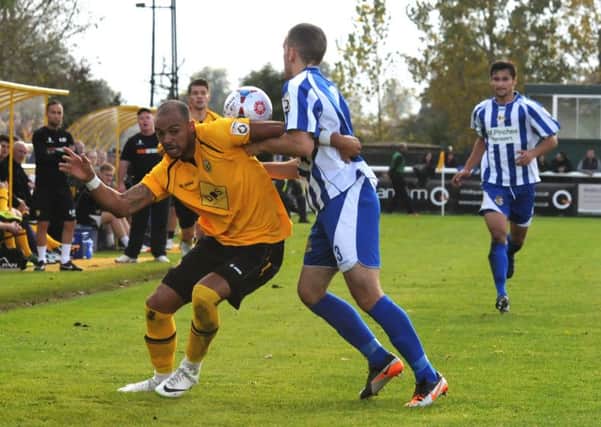 Leamington's Matt Dodd battles with Worcester's Tyler Weir during the sides' first cup meeting at the New Windmill.