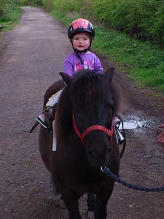Paul Funnell's daughter riding the family's pony.