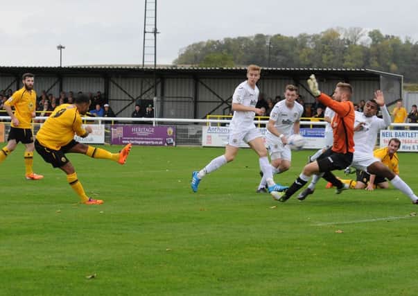 Stockport keeper Danny Hurst and defender Jordan Fagbola throw themselves in the way of Stefan Moores first-half strike. Picture: Morris Troughton