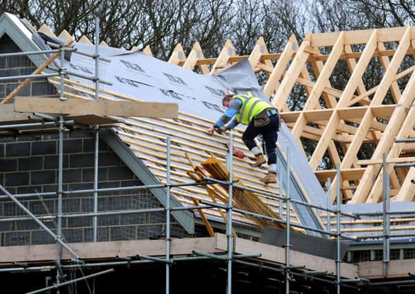 A builder working on new housing