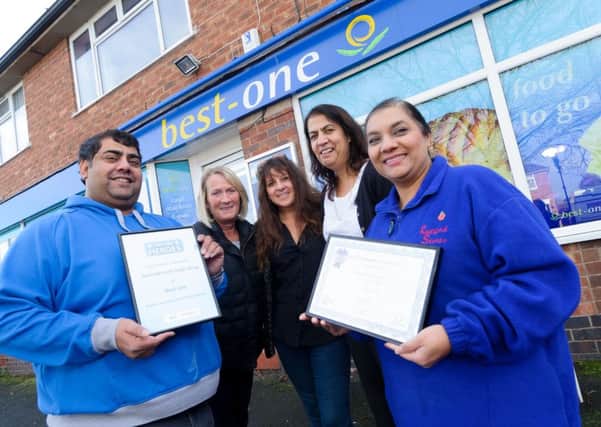 Gurjit & Gurinder Ghag, who run the village store in Radford Semele, were recently presented with two national awards for their community work.  Pictured: Gurinder Ghag, Carol Formosa, Julie Law, Narinder Dhillon & Gurjit Ghag. NNL-140411-232819009