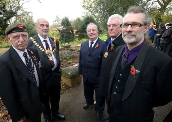 To mark the centenary of the outbreak of World War One, a commemorative sculpture 'Barbed Poppies', was unveiled and dedicated in Jephson Gardens, Leamington, on Tuesday. Pictured with artist Tim Tolkien (front right) are (from l-r) Vince Watson of the Leamington branch of the Royal British Legion, Leamington Mayor Cllr John Kinght and Warwick district councillors Dave Shilton and Alan Wilkinson.