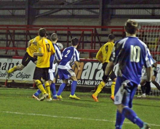 Danny Newton heads home at the far post to give Brakes late hope at Aggborough. Picture: Sally Ellis