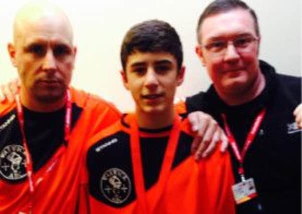 Joe Horrocks with coaches Roy Thornton and Derek Fitzpatrick. Picture submitted