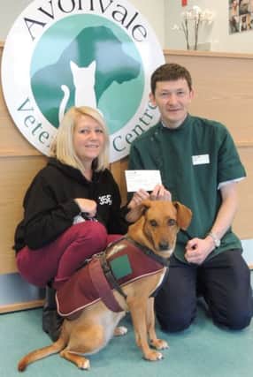 Sandi Lewis, pictured with Pegasus, receives the cheque from senior Avonvale vet Kieran OHalloran.