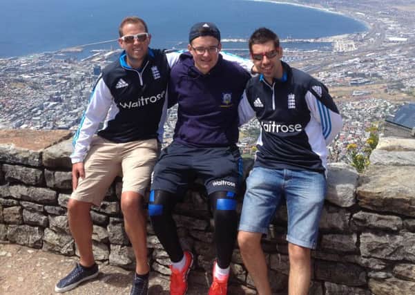 Justin Hollingsworth, centre, with Gav Dean and England captain Matt Dean on top of Table Mountain. Picture submitted