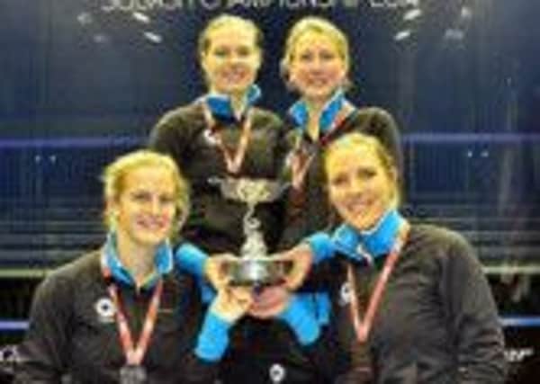 Emma Beddoes and Sarah-Jane Perry celebrate Englands world title alongside Alison Waters and Laura Massaro.