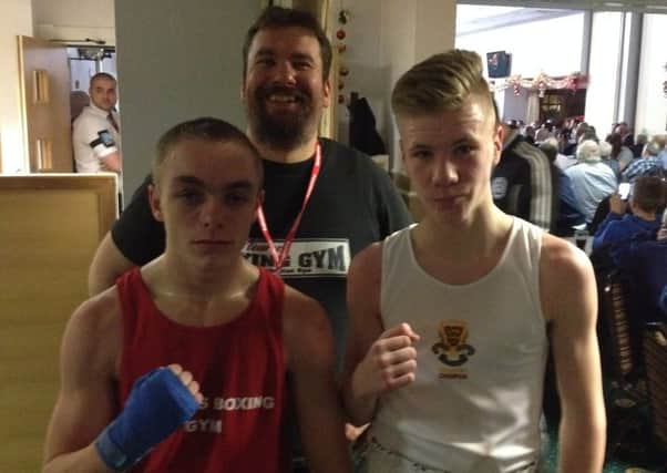 Jake Finch, left, with his trainer Adam Blockley and Sam Gwilt. Picture submitted
