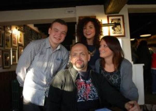 Matthew Beresford with his children Sam, Sophie and Zoe.