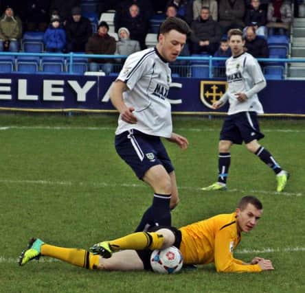 Jordan Goddard hits the deck while challenging Guiseleys Danny Ellis at Nethermoor last Saturday. Picture: Sally Ellis