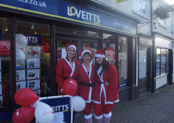 Staff at Loveitts in Southam took part in the Wear a Santa Suit to Work Day to raise money for the Myton Hospices.