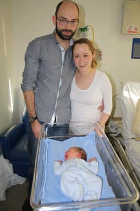 Proud parents James and Stephanie Beard with baby Jack.