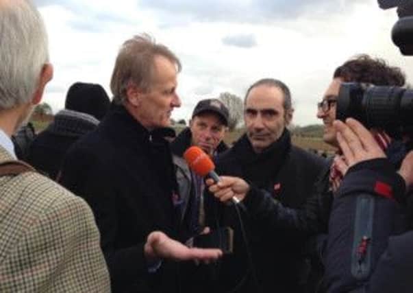 Sir Andrew Hamilton is interviewed by Belgian television during the unveiling of the memorial for the Christmas Truce of 1914 at St Yvon.