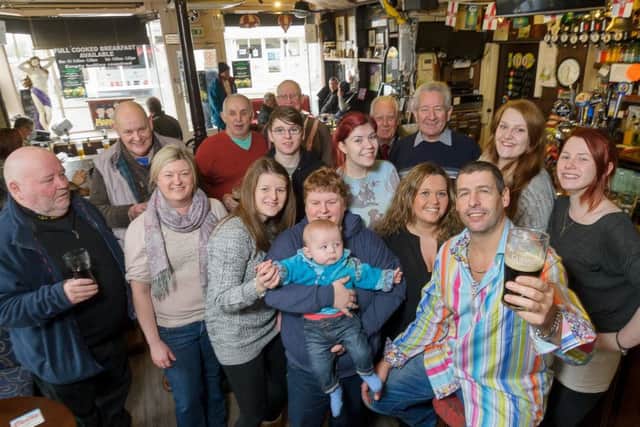 Murphy's Bar,in Regent Street, Leamington, has recently been voted as The Courier and Weekly News' Bar of the Year 2014.  Pictured: Kevin Murphy (Owner), together with staff, friends, family and regulars. NNL-150113-215432009