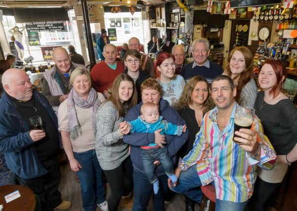 Murphy's Bar,in Regent Street, Leamington, has recently been voted as The Courier and Weekly News' Bar of the Year 2014.  Pictured: Kevin Murphy (Owner), together with staff, friends, family and regulars. NNL-150113-215432009