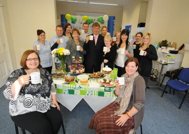 Macmillan Coffee morning event at The Care Bureau, 15 Waterloo Place, Warwick Street, Leamington.
Anne Marshall (Sales and Marketing Manager) and Sarah Castle (P.A. to the directors) - both seated - are seen with John Dunster (Director - standing, centre) and other staff.
MHLC 27-09-13 Coffee Bureau Sep32 ENGNNL00120130927170028