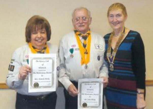 Pam and John Hinks, founders of 7th Warwick Scouts, with Rotary president Jackie Crampton