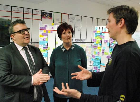 Labour MP Tom Watson and Labours Prospective Parliamentary Candidate for Warwick and Leamington, Lynnette Kelly, with the studio director of Leamington-based computer games producer Exient, Nick Harper.
