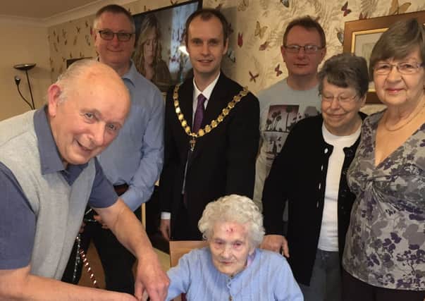 Minnie Davidson with family members and Whitnash Mayor Cllr Robert Margave on her 104th birthday.