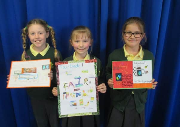 Pupils of Woodloes Primary in Warwidk with their winning Fair Trade posters.