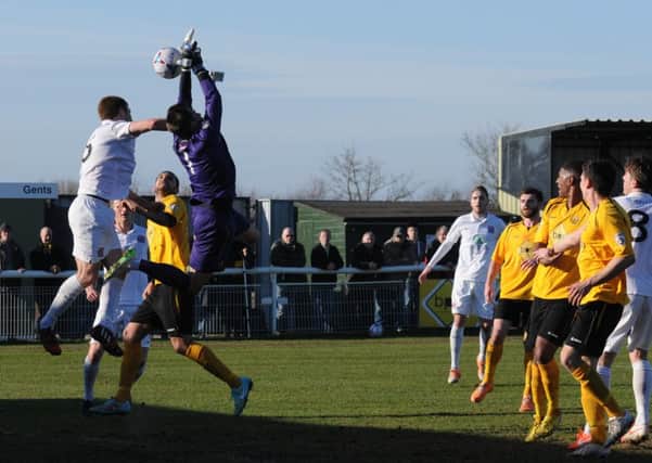 Leamington keeper Ross Atkins looks to be impeded in the build-up to Fyldes second on Saturday. Picture: Morris Troughton