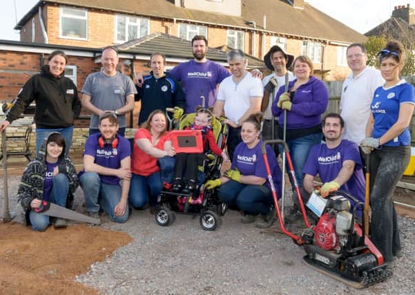 Seriously ill six-year-old Hannah Eykyn from Warwick, is getting a Charity Garden Make-Over.  Pictured: Hannah, Tara (Mum), Steohen (Dad) and the Charity Garden Make-Over Team from Experian, Well Child & Colliers, at the close of day 1 of the Make-Over. NNL-151003-224205009