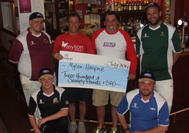 Last years team captains and league sponsor Jason Ashley hand over the a charity donation to Danny Fox from Myton Hospice.