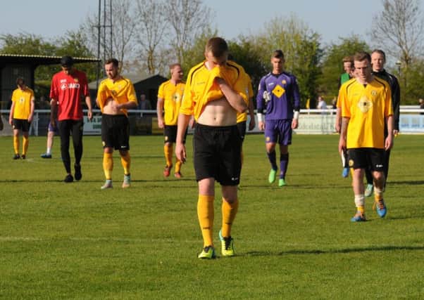 Leamington players, led by Jordan Goddard, troop off after relegation was confirmed. Picture Morris Troughton