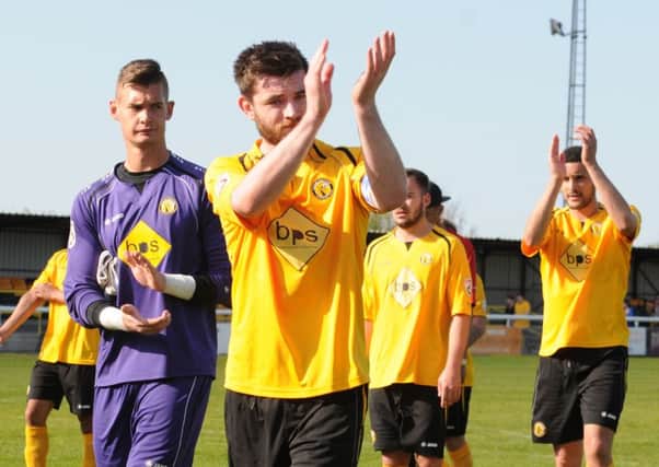 Danny Newton salutes the home fans after Brakes relegation from the Conference North was confirmed. Picture: Morris Troughton
