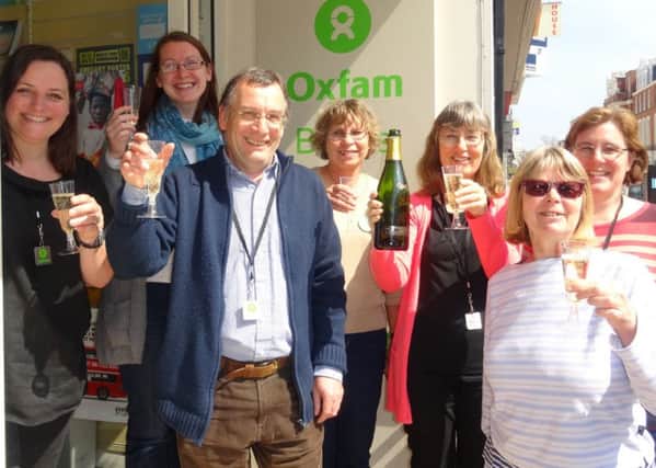 Celebrating raising £1.2 million in ten years, Oxfam Books & Music volunteers (from left to right) Sarah Paget Wall, Shop Manager Jen Thornton, Jeremy Lampitt, Jenny Morgan, Sally Knight, Diane Burton, and Lydia Halliday.