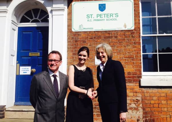 Home Secretary Theresa May (right) with St Peter's Primary School's headteacher Tess McNamara and Warwick and Leamington parliamentary candidate Chris White.