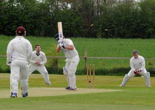 Bedworth skipper Jason Jakeman sees his innings ended on 44 by Joe Boyle. Picture: Morris Troughton