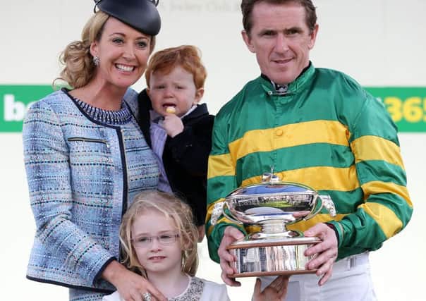 Chanelle and AP McCoy with their son Archie and daughter Eve on his retirement day at Sandown. Picture: PA.