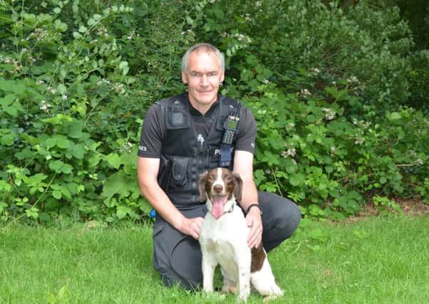 Pc Andy Crouch with police dog Jake.