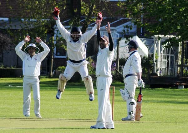 The Alvis fielders are convinced they have claimed the wicket of Jon Davis, who went on to score an unbeaten 59 for Warwick. Picture: Morris Troughton