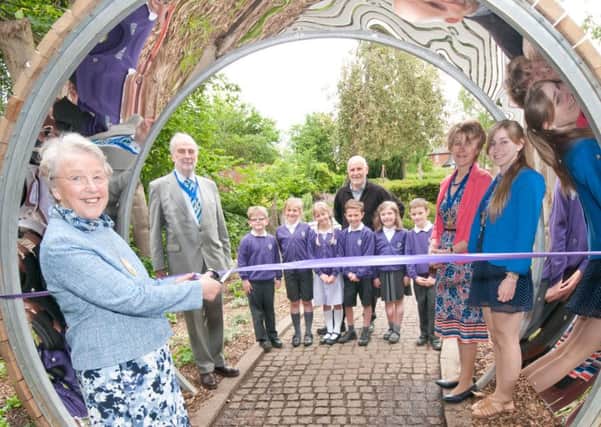 Cllr Jane Knight, vice chairman of Warwick District Council, opens the new sensory garden at Jephson Gardens in Leamington. She is pictured with her husband  Cllr John Knight, The Mayor of Leamington Cllr Angela Stevens (and daughter) and Jon Holmes of the council's Green Spaces Team along with pupils from St Theresa's Primary School in Cubbington.