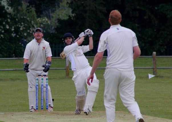 Wicketkeeper Dave Barnett looks on as Earlswood batsman Arron Snipe is about to be caught by John Edden off the bowling ofJamie Maynard. Picture submitted