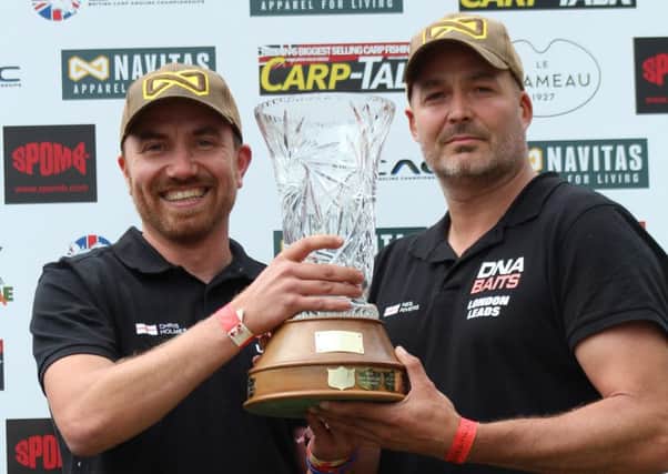 Chris Holmes and Neil Rivers celebrate their British Carp Angling Championship success.