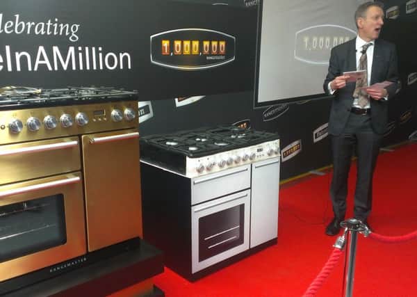 William McGrath, chief executive of the AGA Rangemaster Group, delivers his speech during the unveiling of the company's one millionth range cooker. On the far left is the golden Nexus 90  and closest to Mr McGrath is a special commemorative cake made for the occasion. NNL-150528-111947001