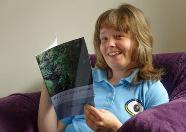 Amy Clennell with her new book
