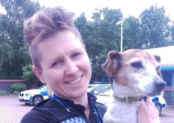Pc Natasha Sunsik, of Warwickshire Police, with Molly the Jack Russell Terrier who was found after being stolen seven years ago from her home in Tyne & Wear.