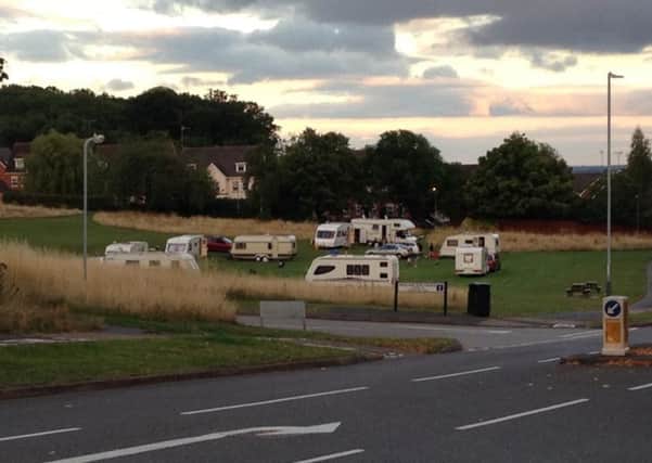 Travellers on the  green space in nearby Hatton Park.