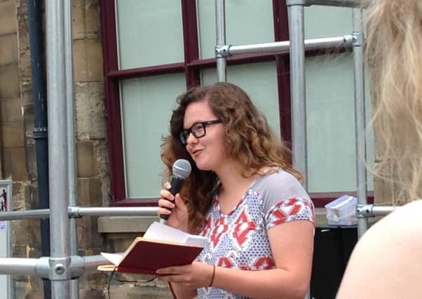 Warwickshire Poet Laureate Lauren Parsons performs in Warwick town centre.