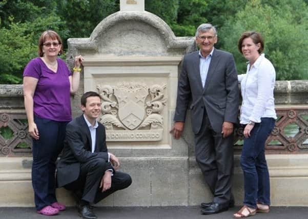 Standing by the restored coat of arms  are (from left) county and town councillor  Sarah Boad, engineer Shane Plumridge, Cllr Peter Butlin, county portfolio holder for transport and planning,  and county councillor Nicola Davies.