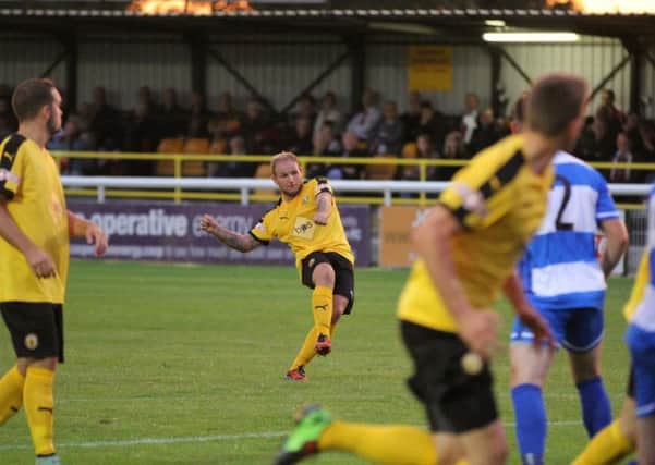 Richard Taundry's perfectly placed free-kick evades the wall of Poppies to put Leamington two goals to the good. Picture: Tim Nunan