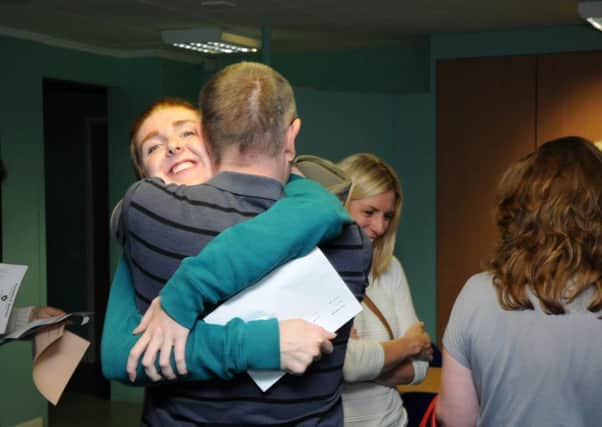 Aylesford's GCSE results.
Aoife Neill is congratulated by her Father Ian.
MHLC-20-08-15 GCSEs Aylesford NNL-150820-124451009