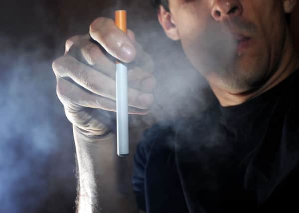 E-cigarettes are less harmful than tobacco and more helpful in quitting smoking says a new report